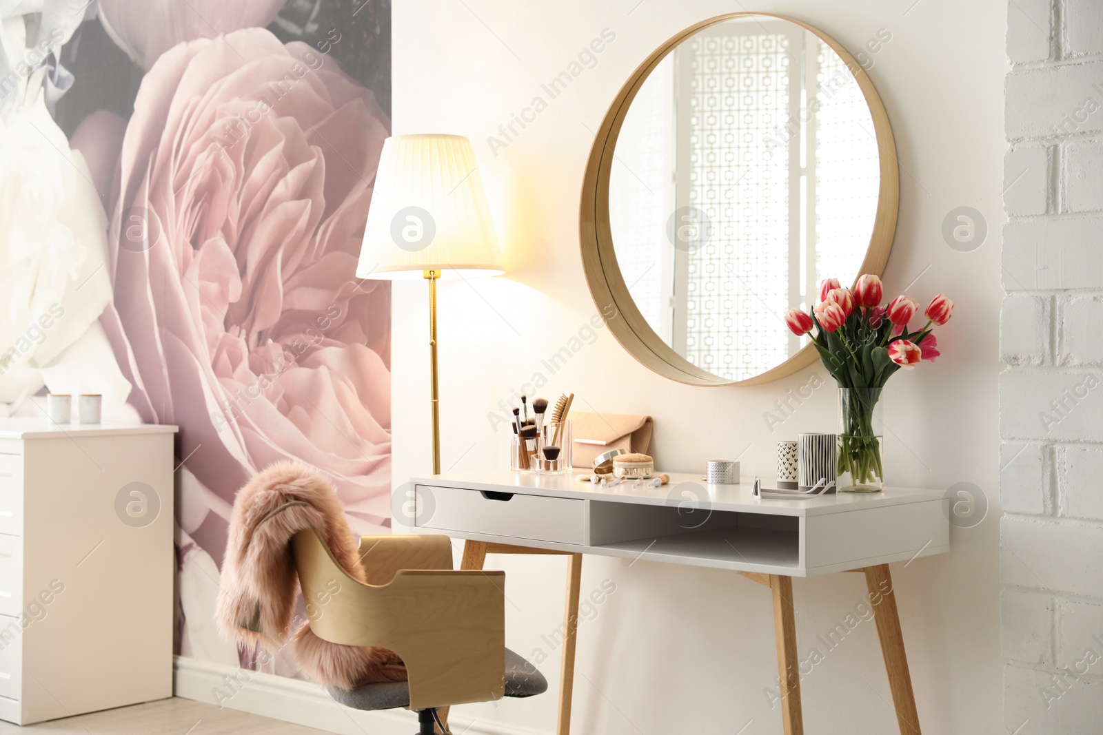 Photo of Stylish room interior with dressing table and mirror