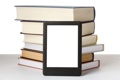 Photo of Modern e-book and stack of hardcover books isolated on white