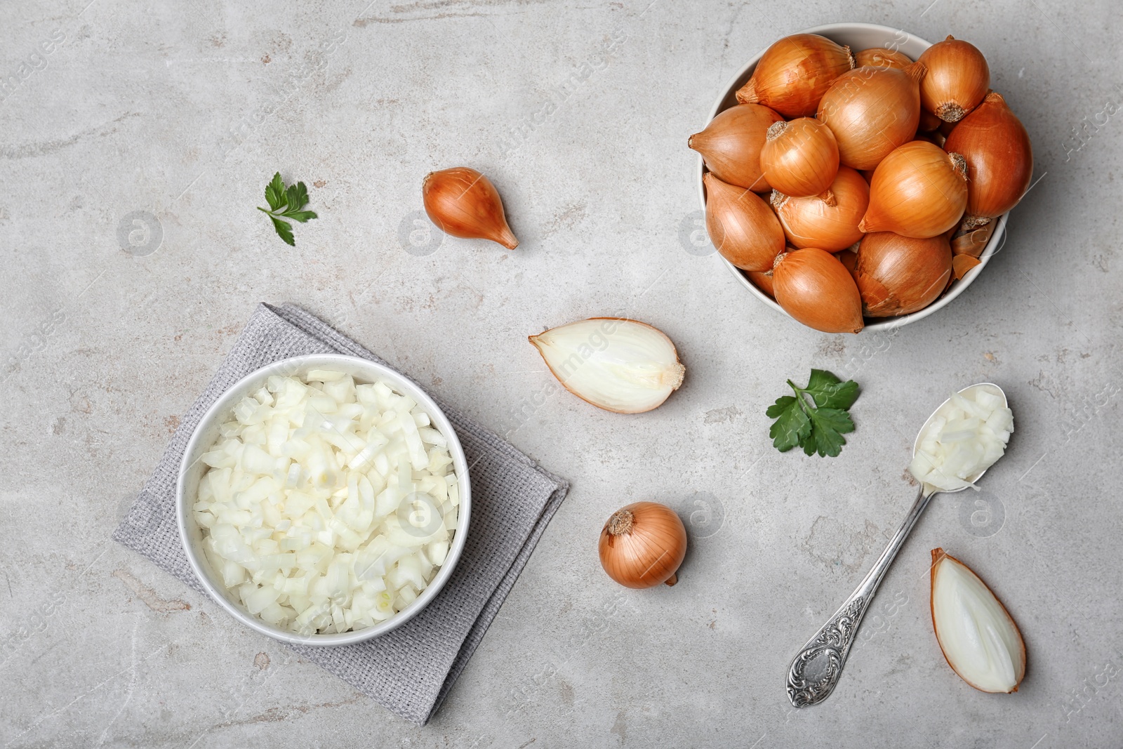 Photo of Flat lay composition with ripe onions on light background