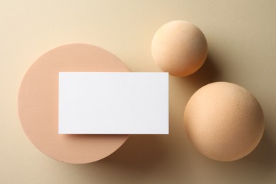 Photo of Empty business card and decorative elements on beige background, flat lay. Mockup for design