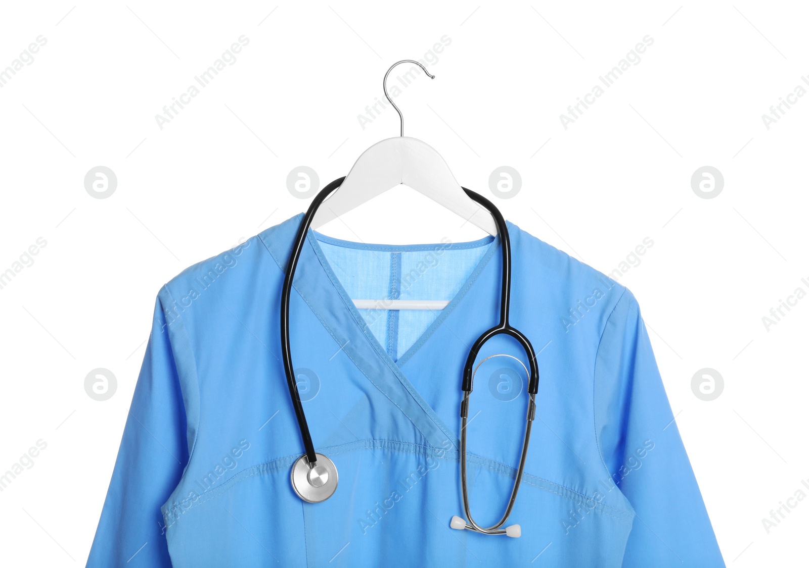 Photo of Light blue medical uniform and stethoscope on white background