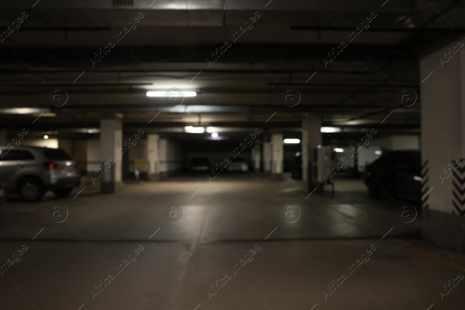 Photo of Blurred view of car parking garage at night