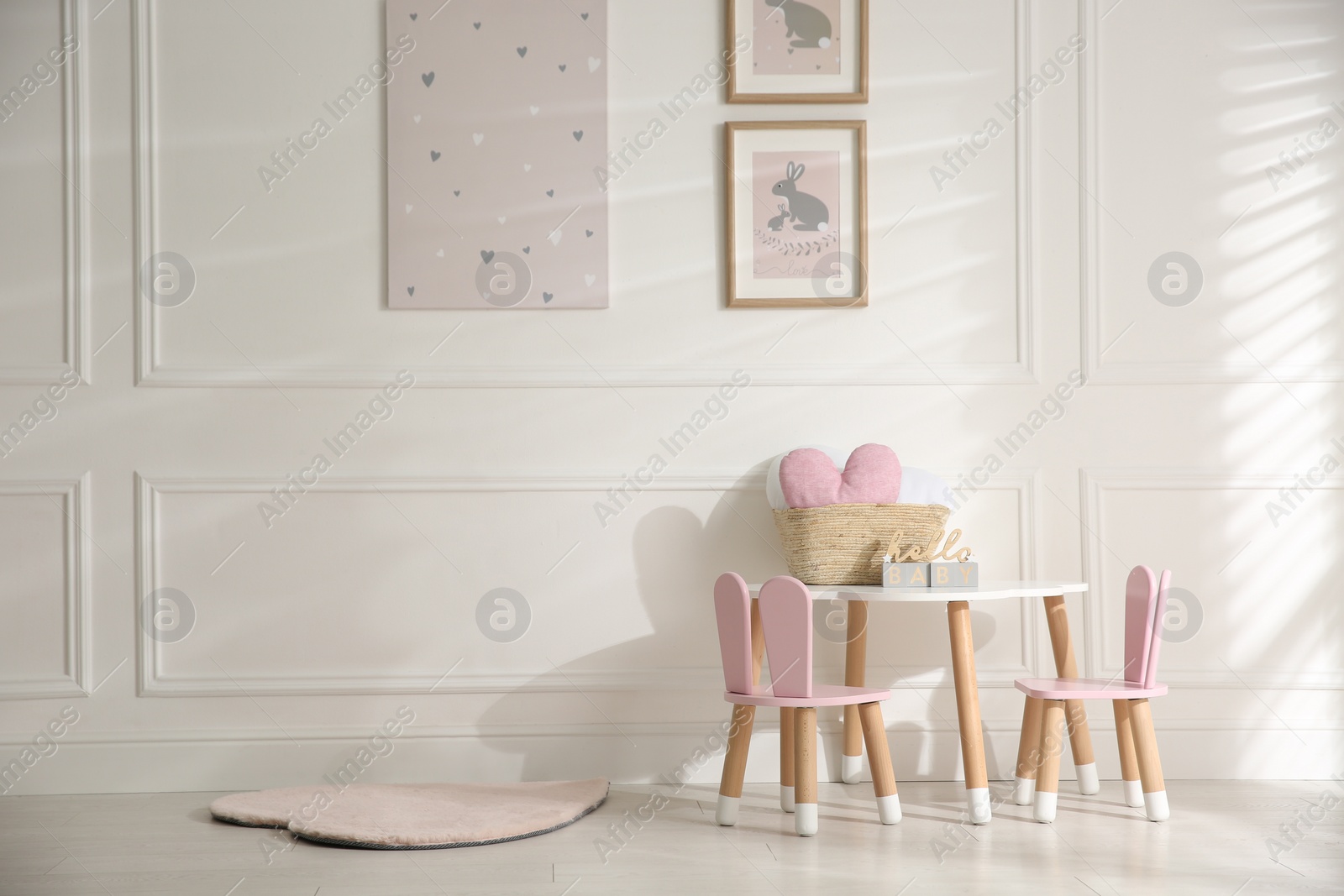 Photo of Baby room interior with stylish furniture and toys