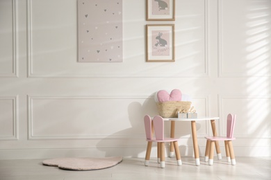 Baby room interior with stylish furniture and toys