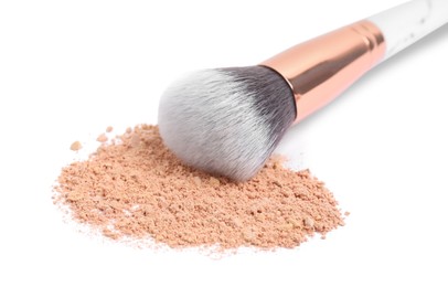 Photo of Loose face powder and makeup brush on white background