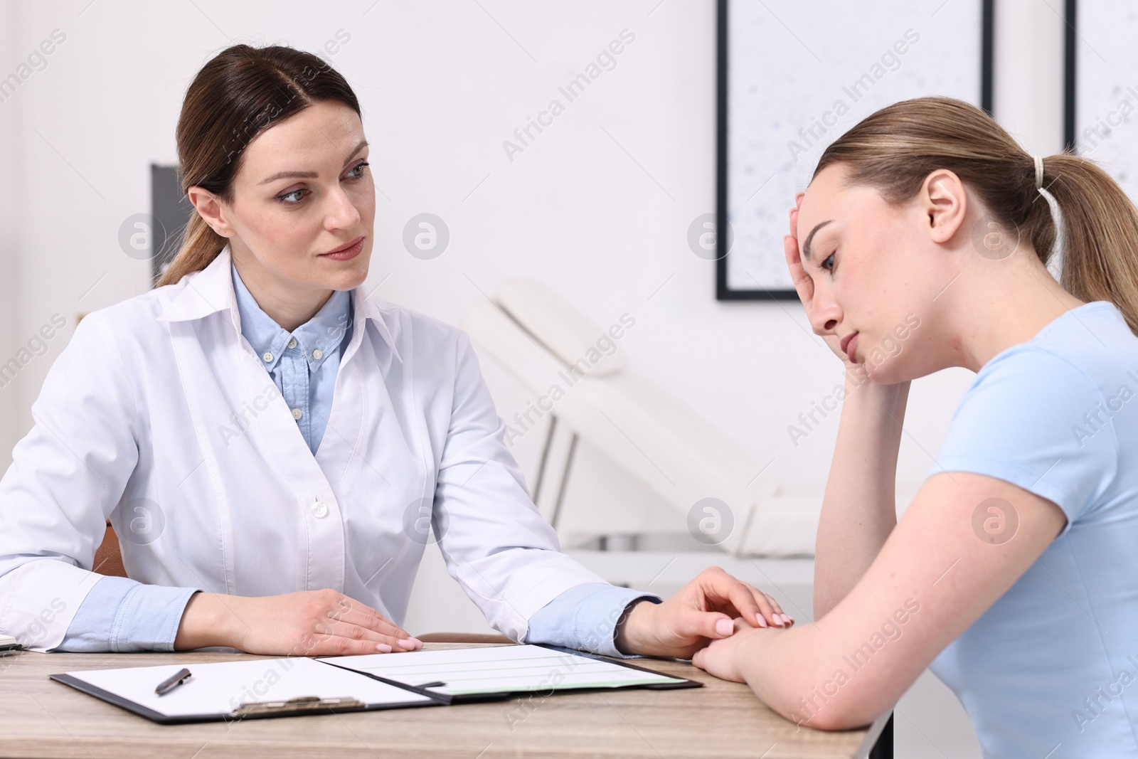 Photo of Mammologist's appointment. Doctor and woman in hospital