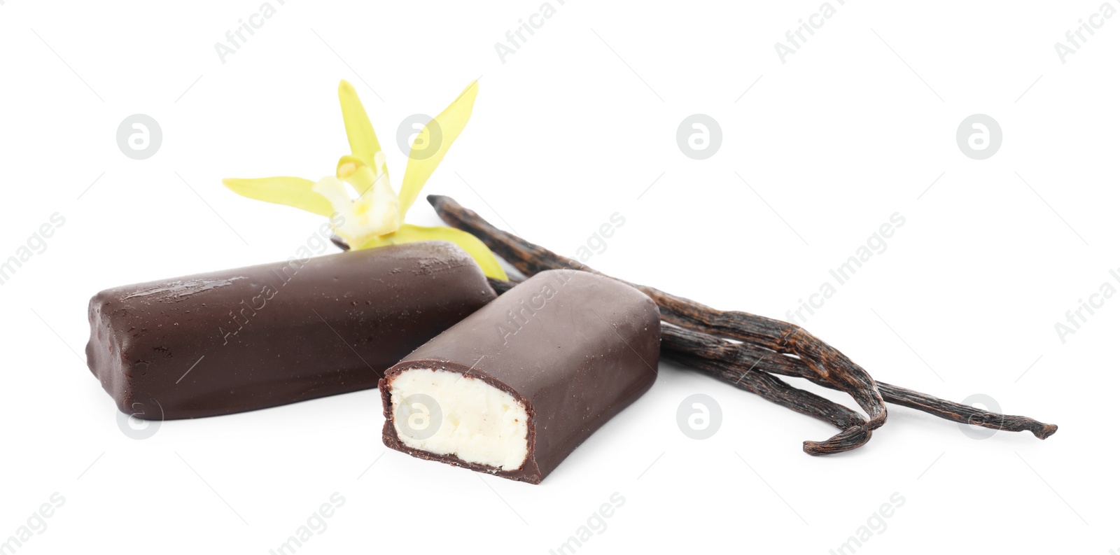 Photo of Glazed curd cheese bars, vanilla pods and flower isolated on white