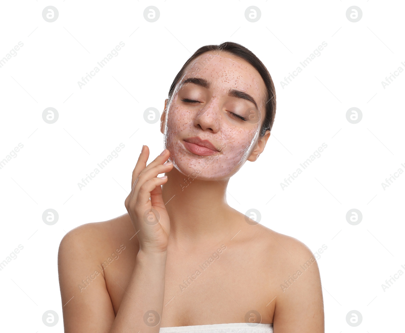 Photo of Woman with pomegranate face mask on white background