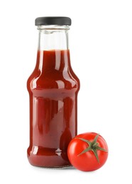 Photo of Glass bottle of tasty ketchup and fresh tomato isolated on white