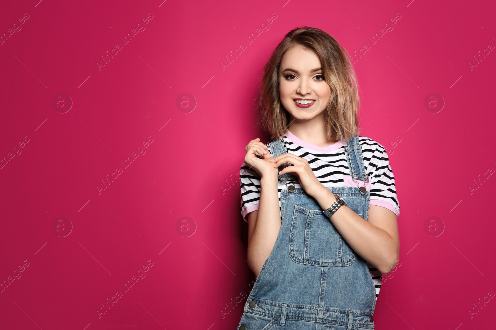 Photo of Beautiful young woman posing on color background