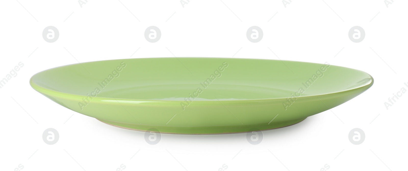 Photo of One beautiful green plate isolated on white