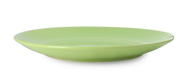 One beautiful green plate isolated on white