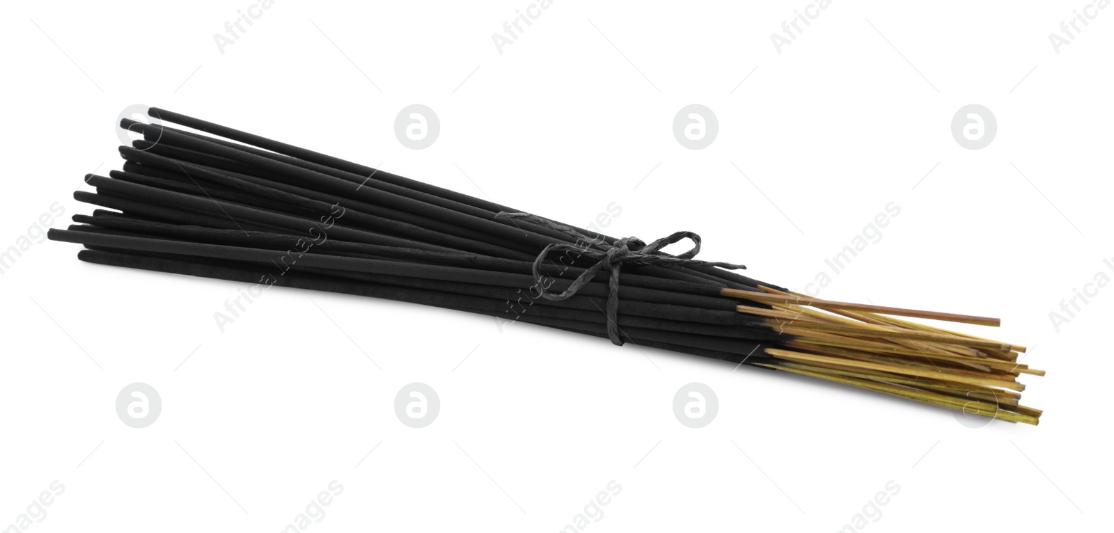 Photo of Many aromatic incense sticks tied with twine on white background