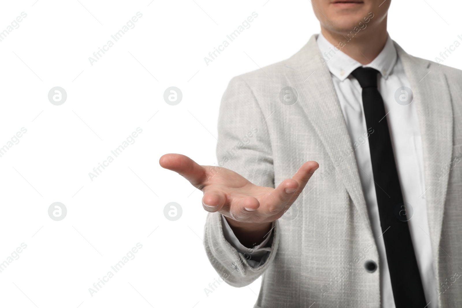 Photo of Businessman holding something on white background, closeup