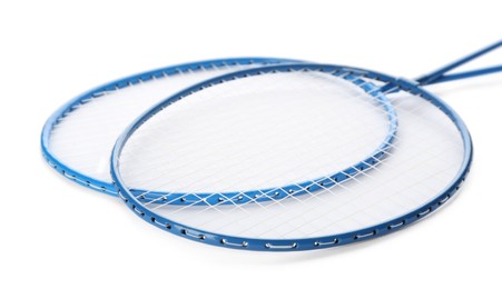 Photo of Badminton rackets on white background. Sport equipment