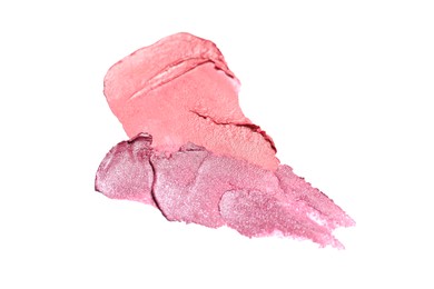 Photo of Smears of bright lipsticks on white background