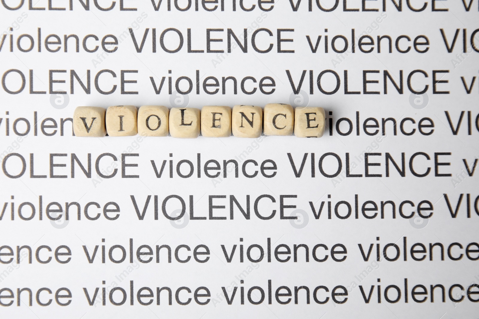 Photo of Sheet of paper with words VIOLENCE, top view