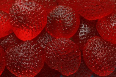 Delicious gummy strawberry candies as background, closeup