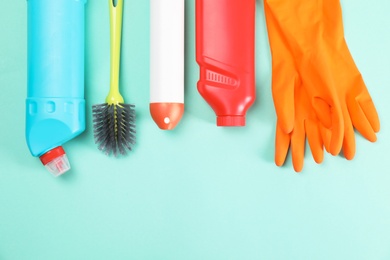 Set of cleaning supplies on color background