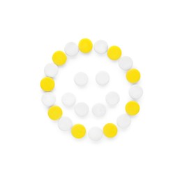 Photo of Happy emoticon made of antidepressants on white background, top view