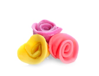 Photo of Colorful roses made from play dough on white background