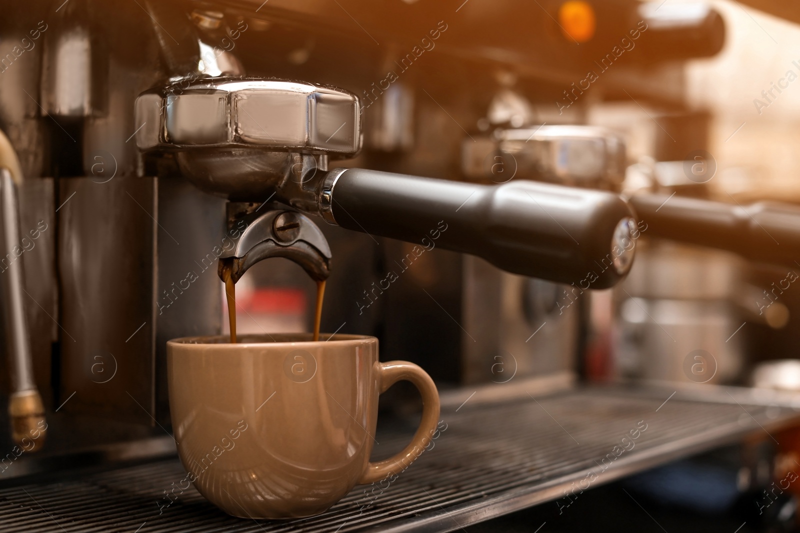 Photo of Preparing fresh aromatic coffee using modern machine, closeup