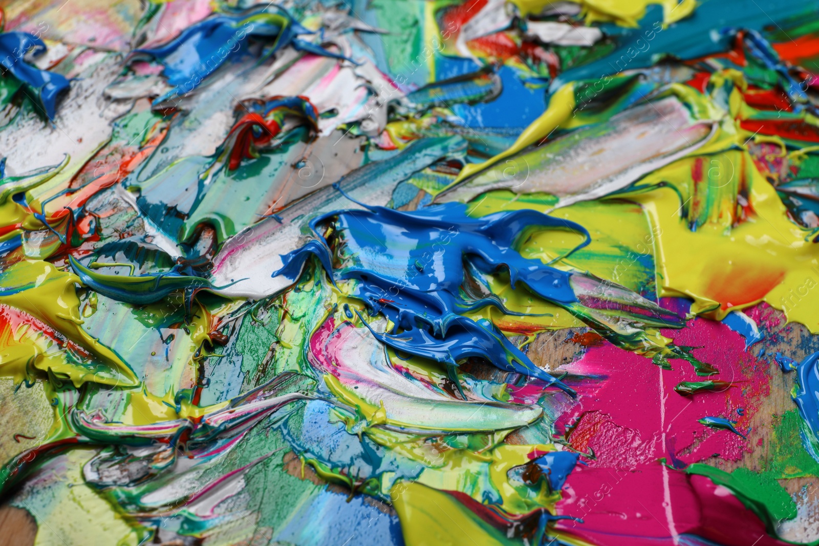 Photo of Abstract colorful acrylic paint as background, closeup view