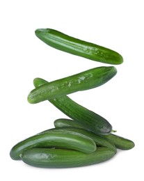 Image of Fresh green cucumbers falling on white background