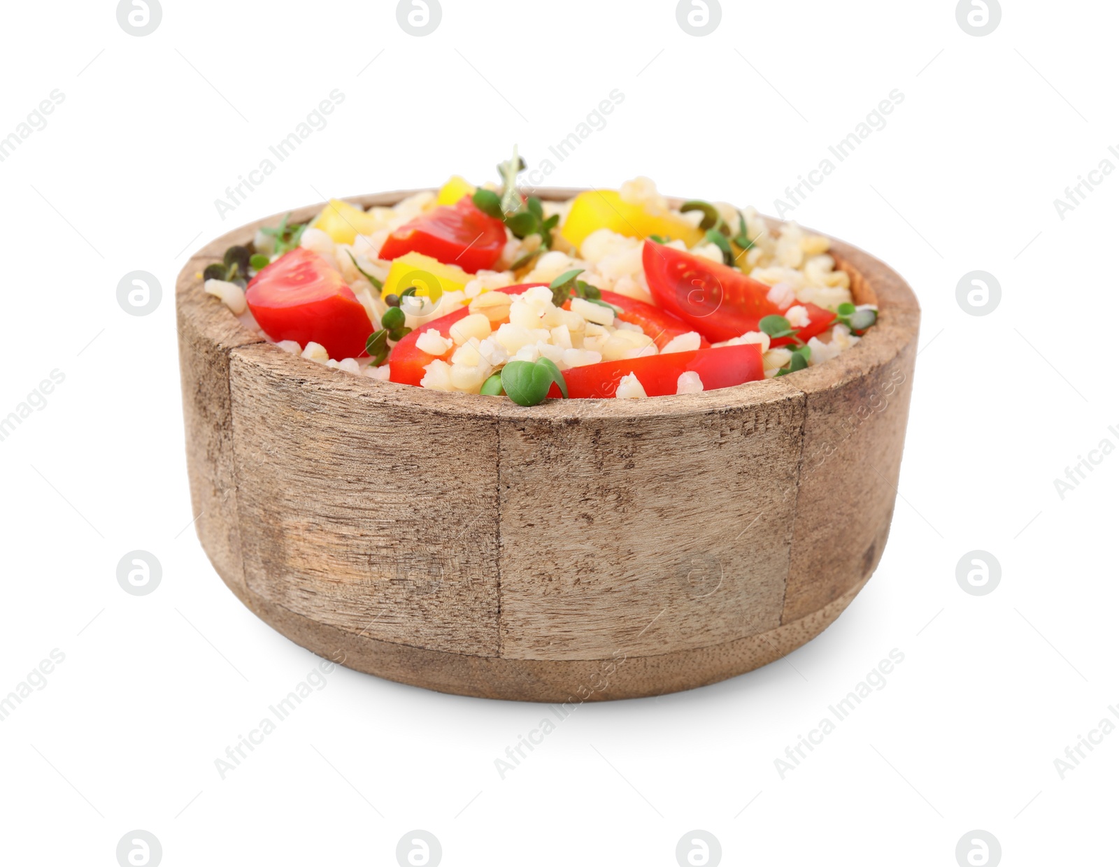 Photo of Cooked bulgur with vegetables in wooden bowl isolated on white