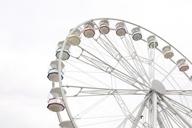 Large white observation wheel against sky, low angle view