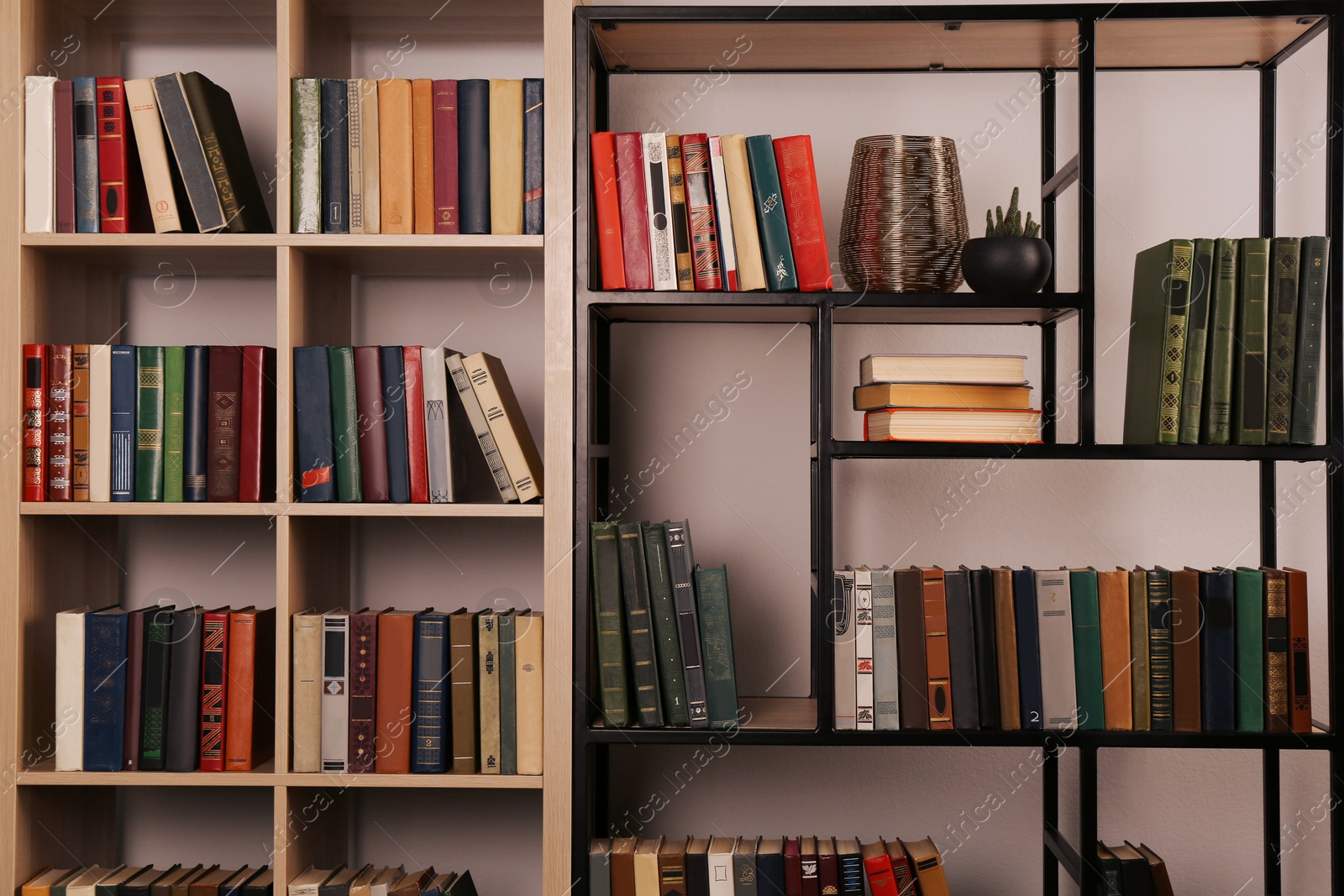 Photo of Collection of different books on shelves in home library