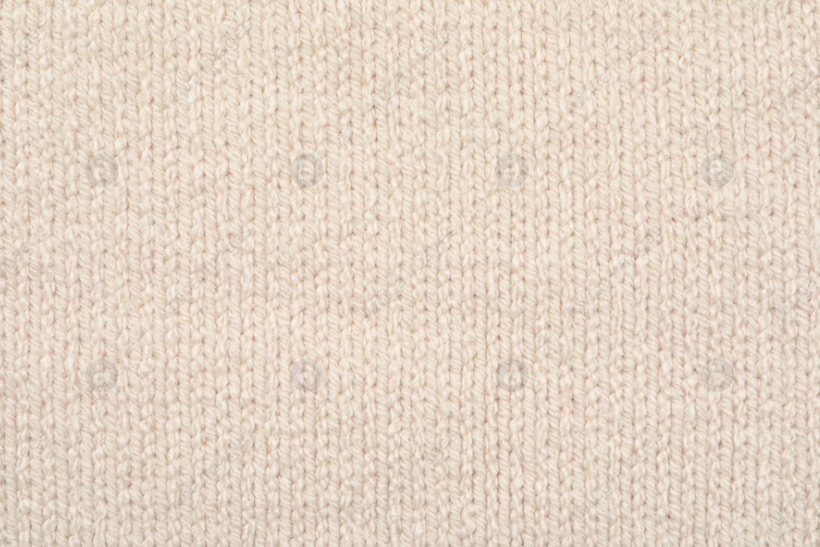 Photo of Texture of cozy warm sweater as background, closeup