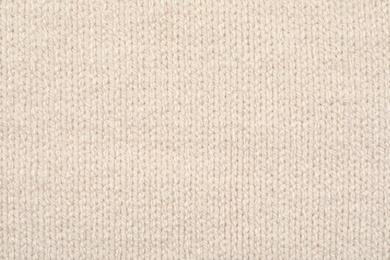 Texture of cozy warm sweater as background, closeup