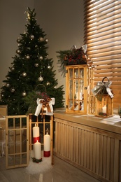 Beautiful wooden Christmas lanterns in decorated room