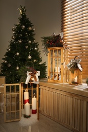 Photo of Beautiful wooden Christmas lanterns in decorated room