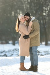 Beautiful young couple enjoying winter day outdoors