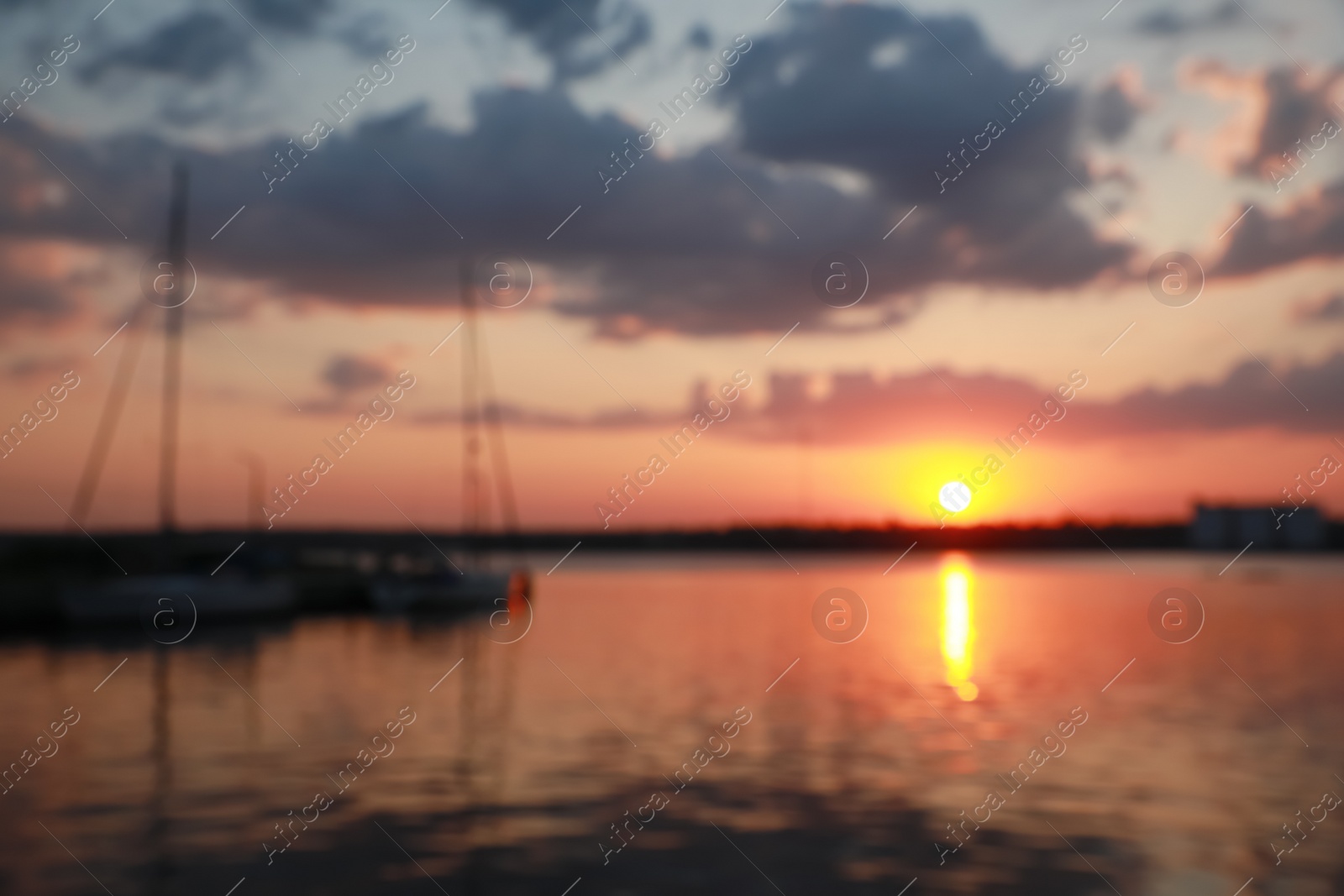 Photo of Blurred view of river pier at sunset