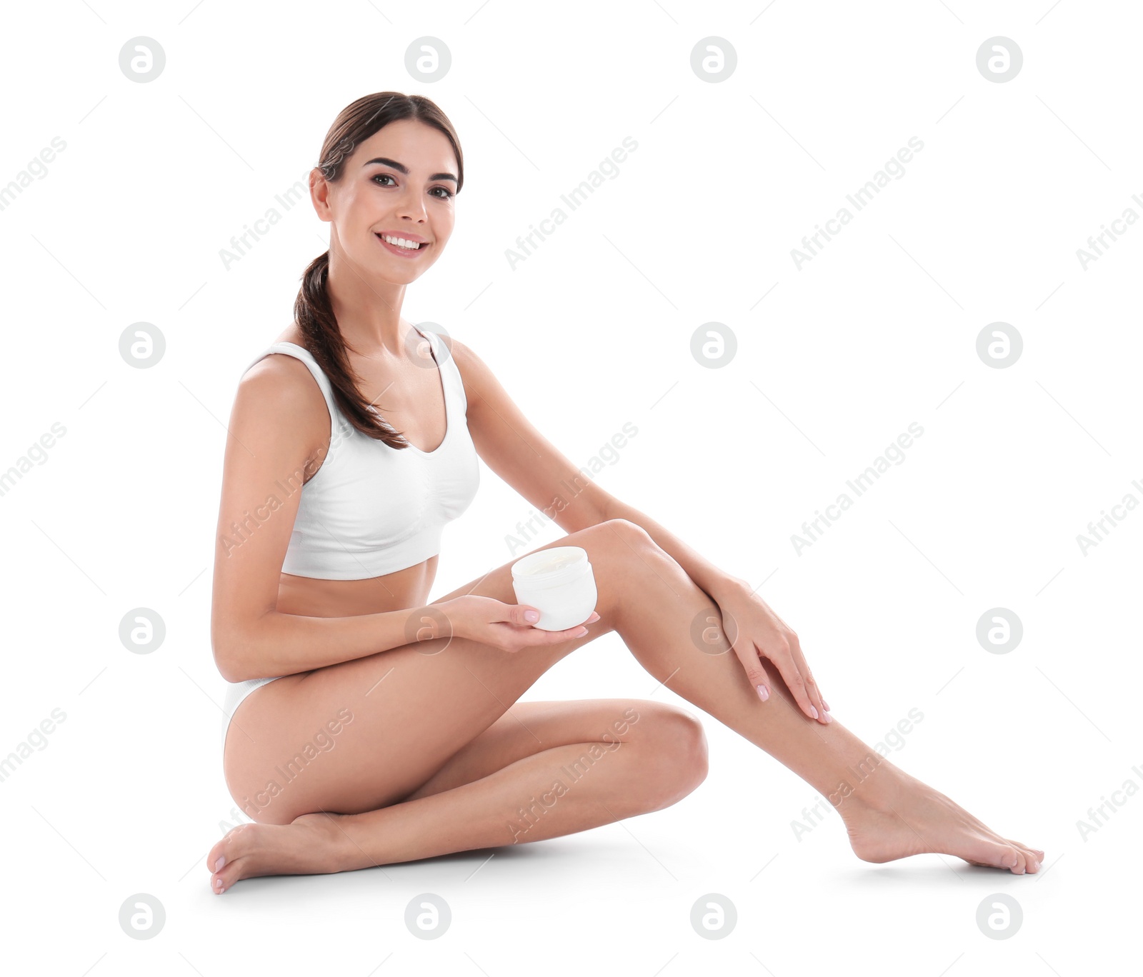 Photo of Young woman with jar of cream on white background. Beauty and body care