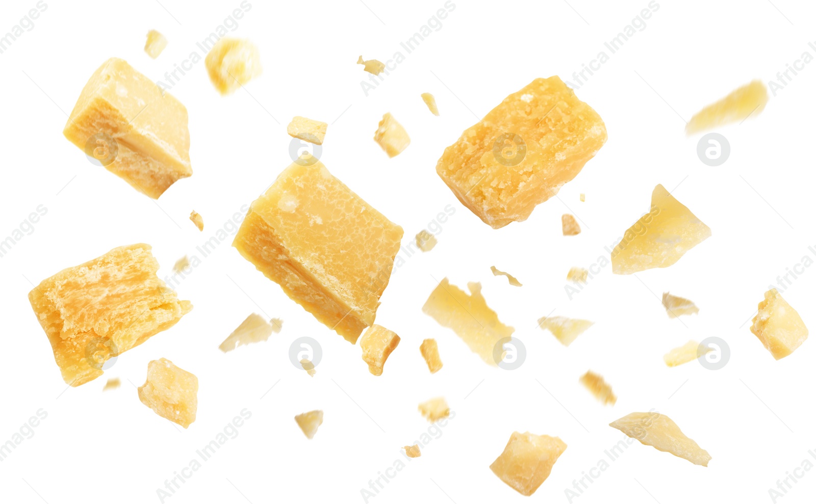 Image of Pieces of delicious parmesan cheese flying on white background