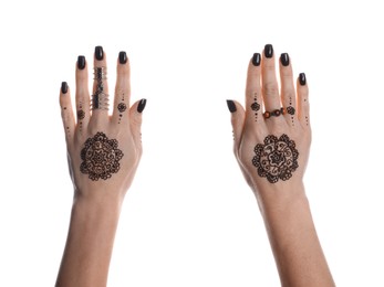Photo of Woman with henna tattoos on hands against white background, closeup. Traditional mehndi ornament