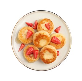 Delicious cottage cheese pancakes with strawberries and honey on white background, top view