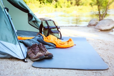 Photo of Sleeping bag and other camping gear outdoors