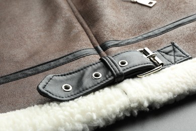 Brown suede jacket as background, closeup view