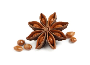 Photo of Dry anise star with seeds on white background