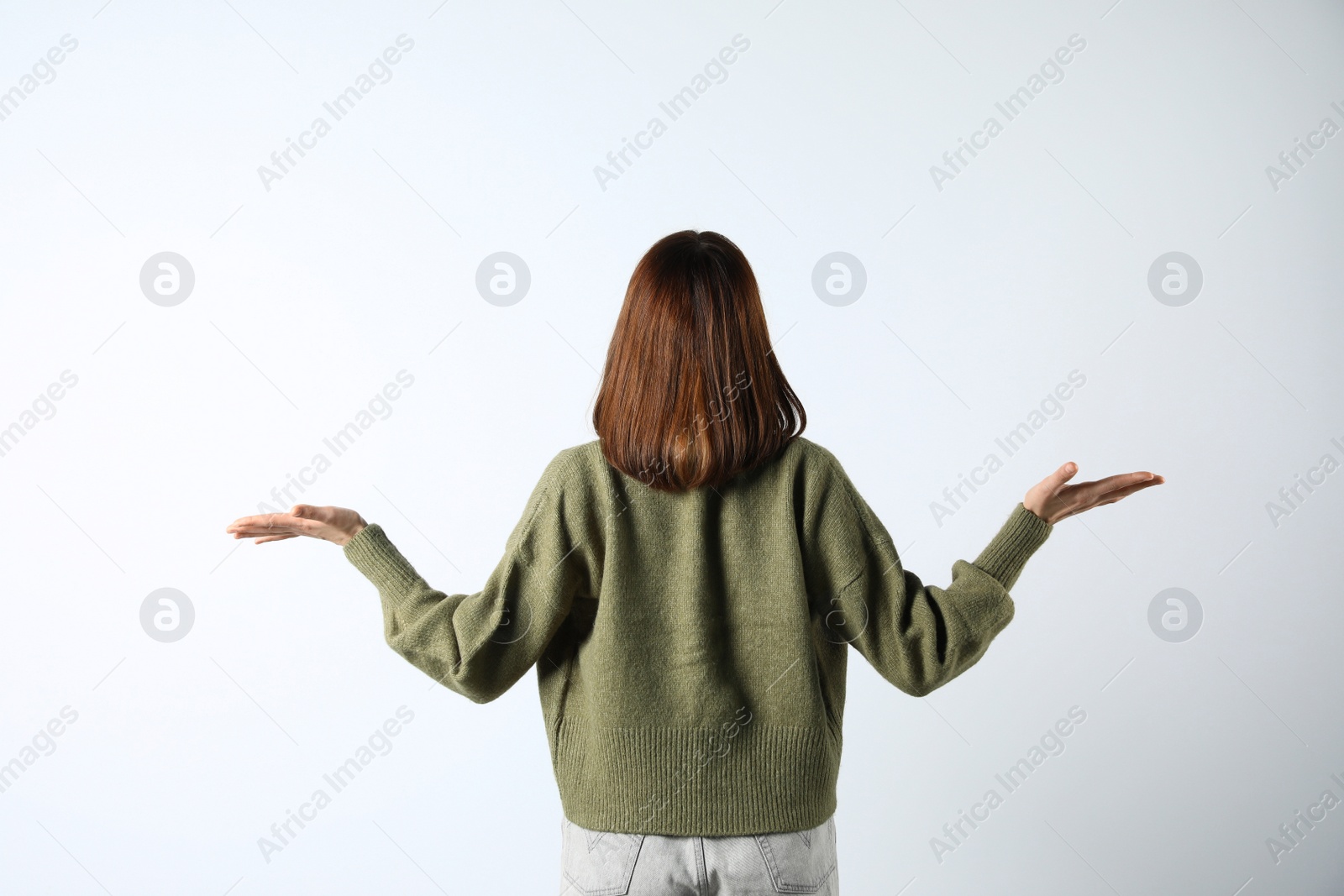 Photo of Girl wearing cardigan on white background, back view