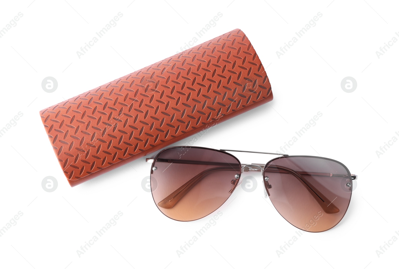 Photo of Stylish sunglasses and brown leather case on white background, top view