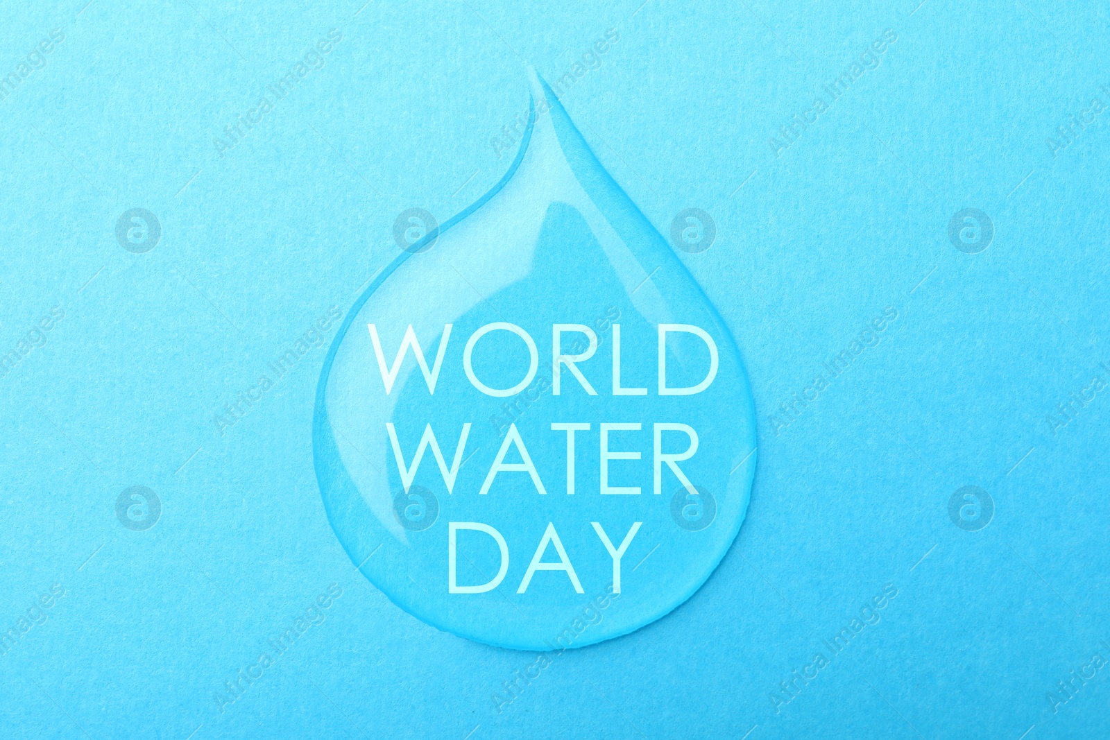 Image of Text World Water Day in drop on light blue background