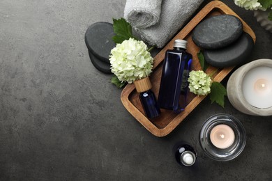 Photo of Flat lay composition with spa products on gray table, space for text