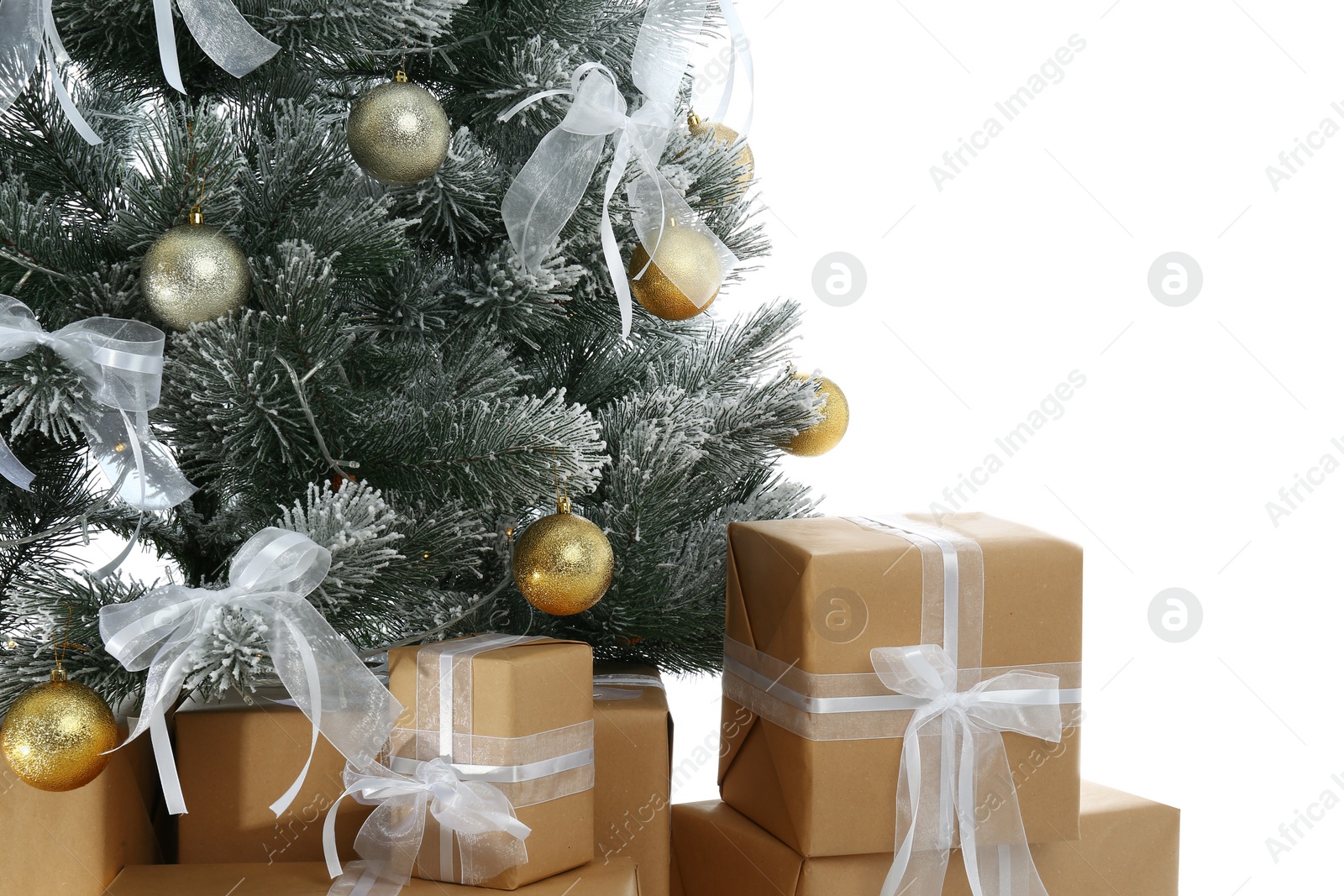 Image of Beautifully decorated Christmas tree and gifts on white background, closeup