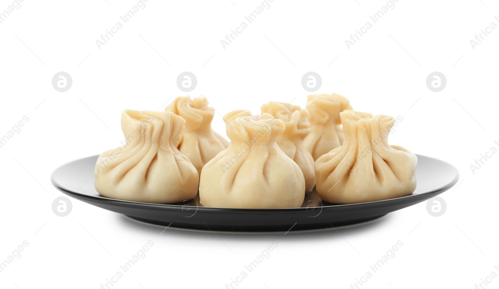 Photo of Plate with tasty dumplings isolated on white